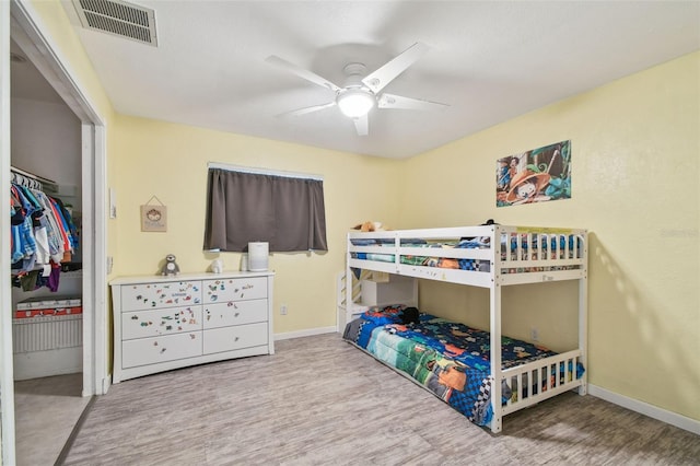 1071 Lexington Ct, Largo, FL 33771 - bedroom with wood finished floors and ceiling fan