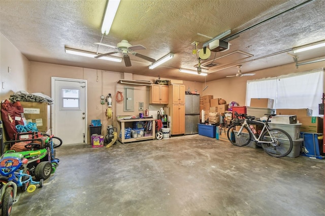 1071 Lexington Ct, Largo, FL 33771 - garage with freestanding refrigerator, a garage door opener, and ceiling fan
