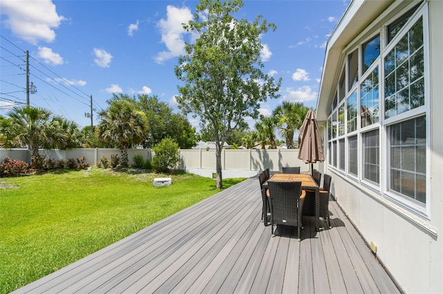 1071 Lexington Ct, Largo, FL 33771 - wooden terrace with outdoor dining space and a fenced backyard