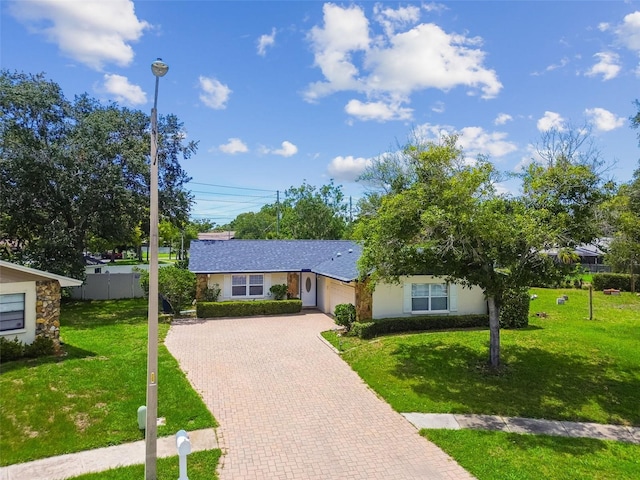 1071 Lexington Ct, Largo, FL 33771 - view of front of house featuring an attached garage and decorative driveway