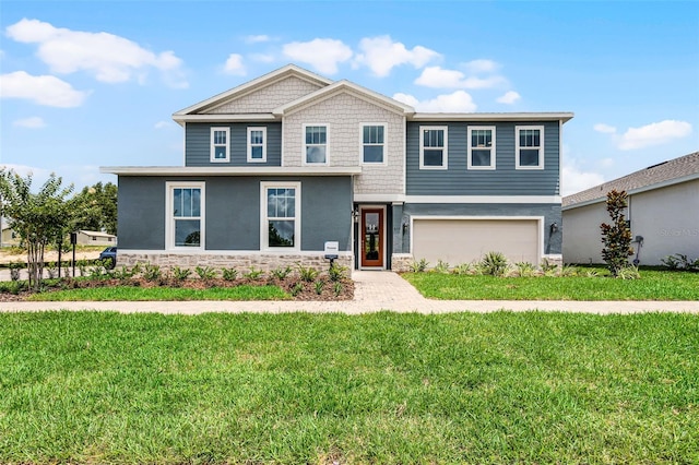 823 Emerald Grove Dr, Apopka, FL 32703 - view of front of property with stone siding, stucco siding, a front lawn, and a garage