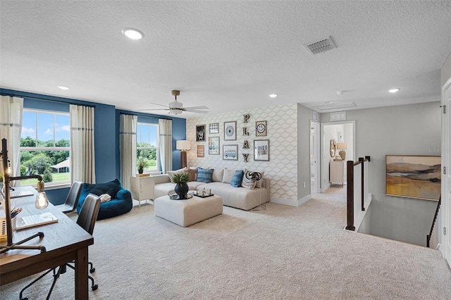 823 Emerald Grove Dr, Apopka, FL 32703 - office featuring light carpet, wallpapered walls, an accent wall, a textured ceiling, and a ceiling fan