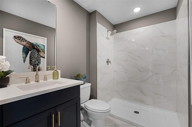 823 Emerald Grove Dr, Apopka, FL 32703 - bathroom featuring vanity, tiled shower, and marble look tiles