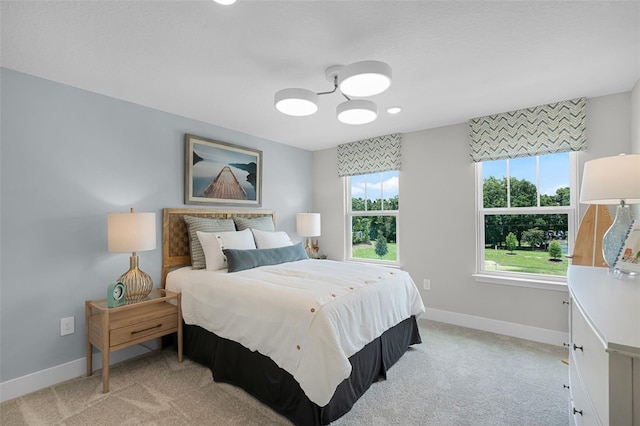 823 Emerald Grove Dr, Apopka, FL 32703 - bedroom featuring light carpet and a chandelier