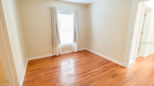 423 E Kaley St, Orlando, FL 32806 - unfurnished room with light wood-type flooring and baseboards