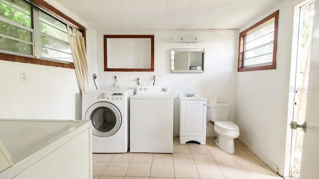 423 E Kaley St, Orlando, FL 32806 - washroom with washing machine and dryer and light tile patterned floors