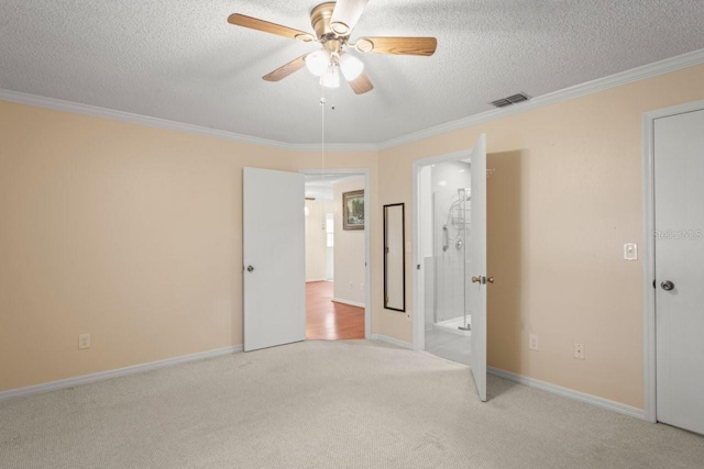 6702 Dartmoor Ln Unit 7A, New Port Richey, FL 34653 - unfurnished bedroom featuring light colored carpet, crown molding, a textured ceiling, and a ceiling fan