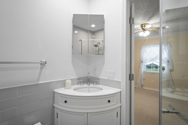6702 Dartmoor Ln Unit 7A, New Port Richey, FL 34653 - bathroom with vanity, ceiling fan, and a shower stall