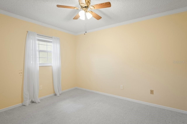 6702 Dartmoor Ln Unit 7A, New Port Richey, FL 34653 - spare room featuring a textured ceiling, ornamental molding, light carpet, and a ceiling fan