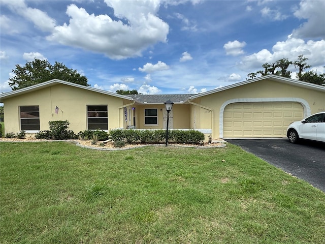12104 Boynton Ln, New Port Richey, FL 34654 - ranch-style house featuring stucco siding, driveway, a garage, and a front lawn