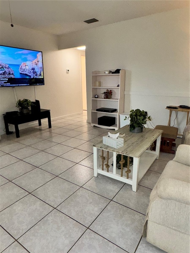 12104 Boynton Ln, New Port Richey, FL 34654 - living room featuring light tile patterned floors