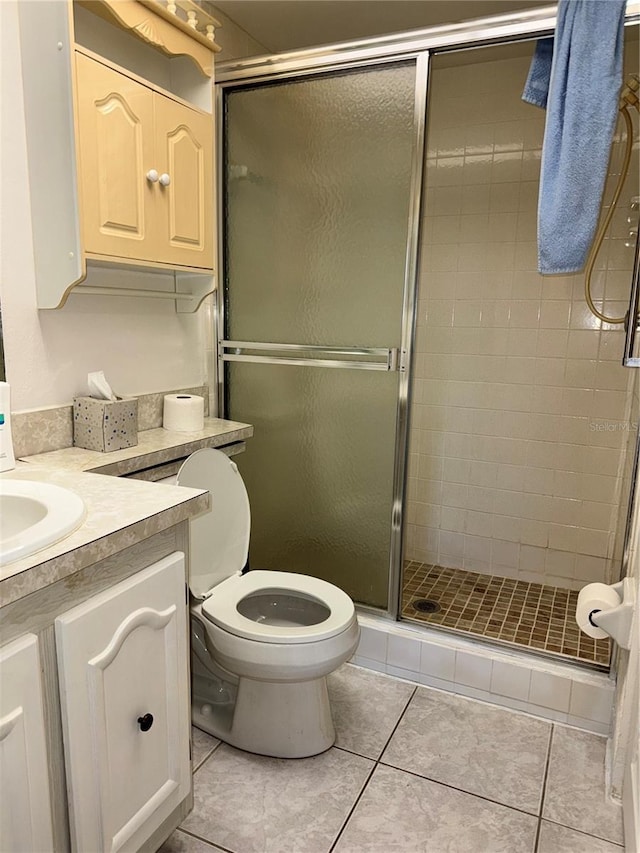 12104 Boynton Ln, New Port Richey, FL 34654 - full bathroom with vanity, a shower stall, and tile patterned floors