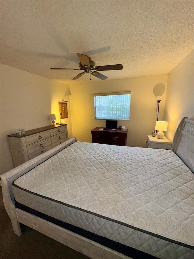 12104 Boynton Ln, New Port Richey, FL 34654 - bedroom featuring a textured ceiling and a ceiling fan