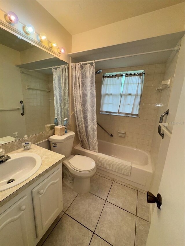 12104 Boynton Ln, New Port Richey, FL 34654 - bathroom featuring shower / bath combo with shower curtain, vanity, and tile patterned floors