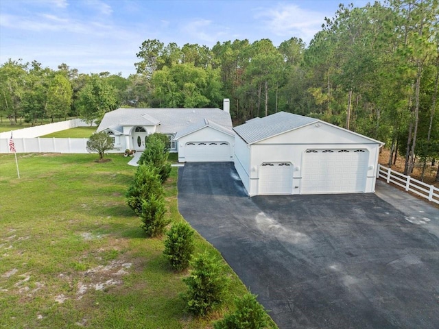 15430 Oakcrest Cir, Brooksville, FL 34604 - view of front of house with an attached garage, a chimney, and a view of trees