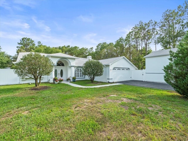 15430 Oakcrest Cir, Brooksville, FL 34604 - view of front facade with asphalt driveway and stucco siding