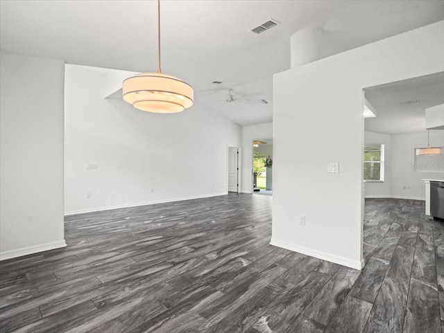 15430 Oakcrest Cir, Brooksville, FL 34604 - unfurnished living room with dark wood finished floors, plenty of natural light, and a ceiling fan