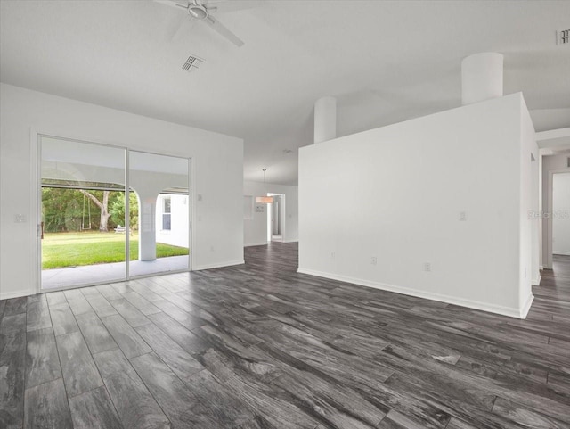 15430 Oakcrest Cir, Brooksville, FL 34604 - unfurnished living room with dark wood-style flooring and a ceiling fan