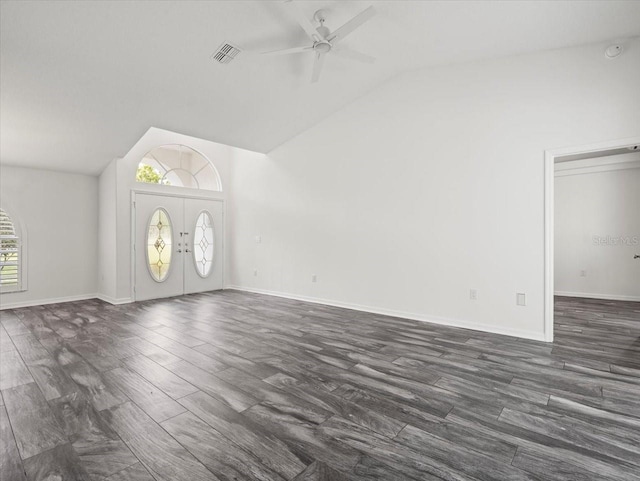 15430 Oakcrest Cir, Brooksville, FL 34604 - unfurnished living room featuring vaulted ceiling, a ceiling fan, and dark wood-type flooring