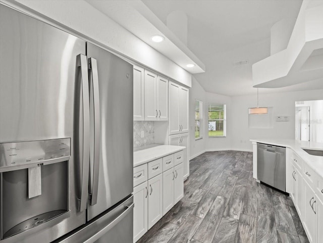 15430 Oakcrest Cir, Brooksville, FL 34604 - kitchen featuring stainless steel appliances, tasteful backsplash, recessed lighting, white cabinetry, and wood finished floors