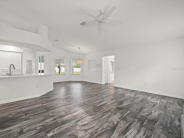 15430 Oakcrest Cir, Brooksville, FL 34604 - unfurnished living room with dark wood-style flooring, a ceiling fan, and lofted ceiling