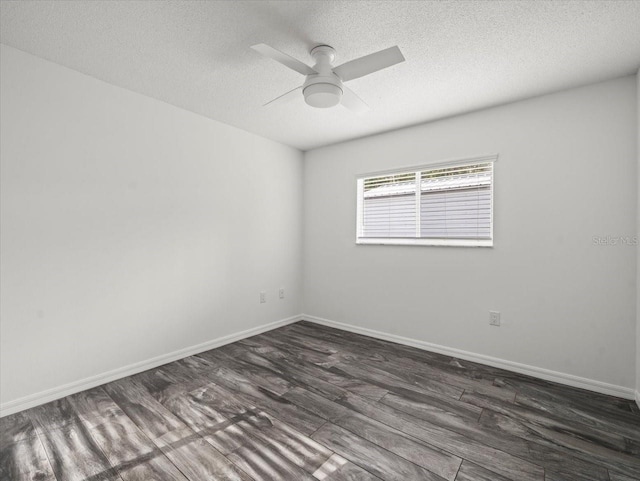 15430 Oakcrest Cir, Brooksville, FL 34604 - empty room with dark wood-style floors, a ceiling fan, and a textured ceiling
