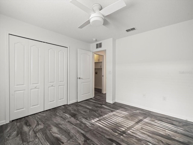 15430 Oakcrest Cir, Brooksville, FL 34604 - unfurnished bedroom featuring a closet, a ceiling fan, and wood finished floors