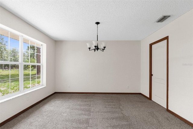 14645 Spellman Ct, Spring Hill, FL 34610 - carpeted empty room featuring a chandelier and a textured ceiling