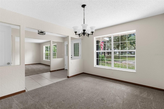 14645 Spellman Ct, Spring Hill, FL 34610 - carpeted spare room with a chandelier, tile patterned flooring, and a textured ceiling