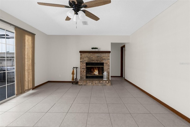 14645 Spellman Ct, Spring Hill, FL 34610 - unfurnished living room featuring a brick fireplace, a ceiling fan, light tile patterned floors, and a textured ceiling