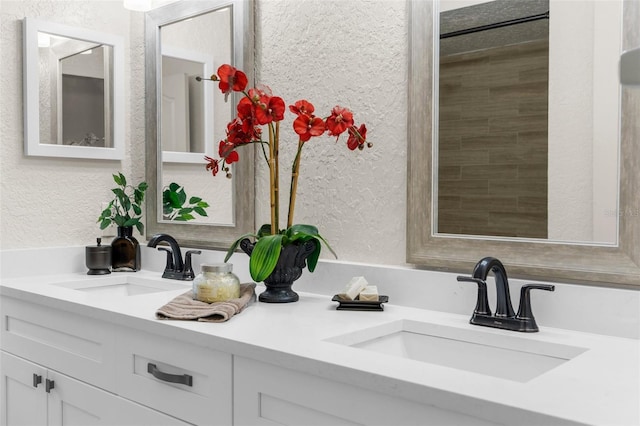 14645 Spellman Ct, Spring Hill, FL 34610 - full bathroom featuring a textured wall and double vanity
