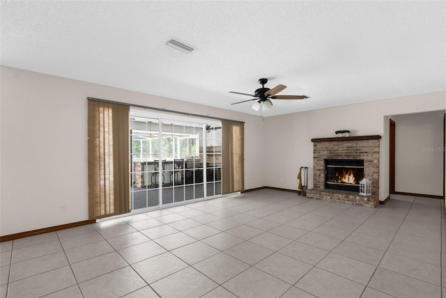 14645 Spellman Ct, Spring Hill, FL 34610 - unfurnished living room with a ceiling fan, a brick fireplace, a textured ceiling, and light tile patterned floors