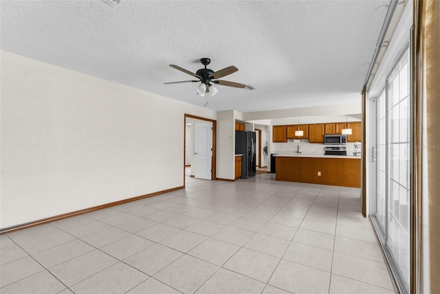 14645 Spellman Ct, Spring Hill, FL 34610 - unfurnished living room featuring a textured ceiling and ceiling fan