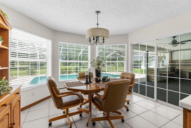 14645 Spellman Ct, Spring Hill, FL 34610 - sunroom featuring a textured ceiling, a chandelier, and tile patterned floors