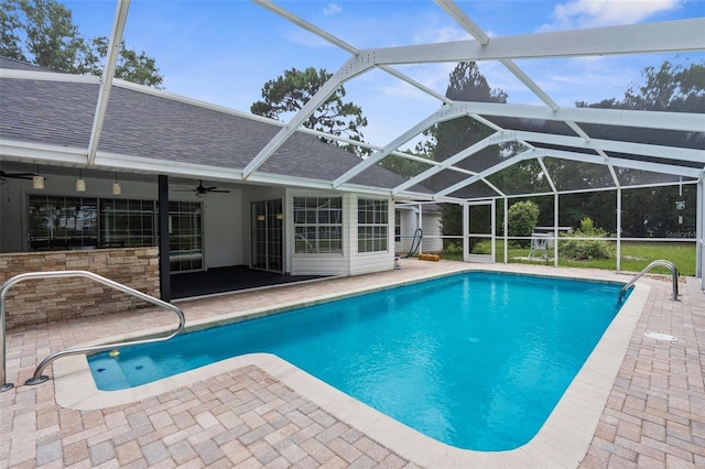 14645 Spellman Ct, Spring Hill, FL 34610 - swimming pool with a patio area, ceiling fan, and glass enclosure