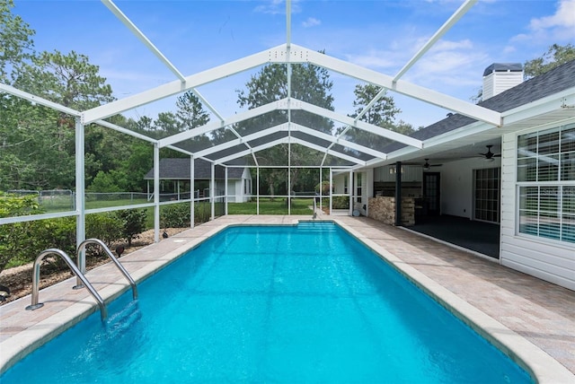 14645 Spellman Ct, Spring Hill, FL 34610 - outdoor pool with ceiling fan, a patio area, and glass enclosure