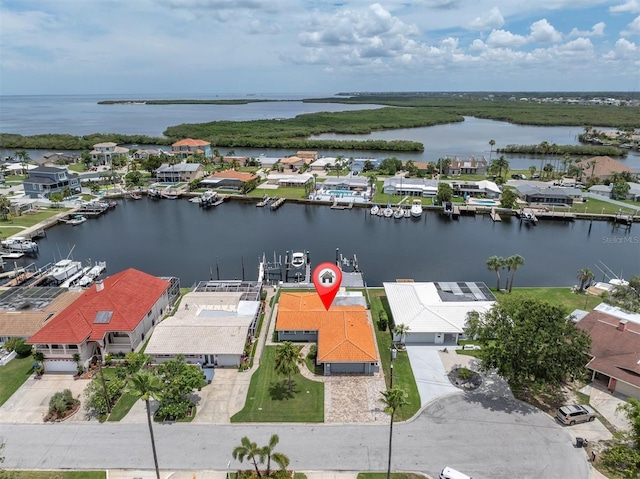 3701 Corsair Ct, New Port Richey, FL 34652 - aerial perspective of suburban area featuring a large body of water