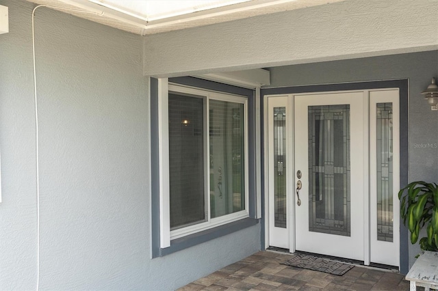 3701 Corsair Ct, New Port Richey, FL 34652 - view of exterior entry with stucco siding
