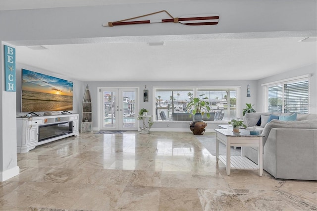 3701 Corsair Ct, New Port Richey, FL 34652 - living area with healthy amount of natural light, light marble finish floors, and french doors