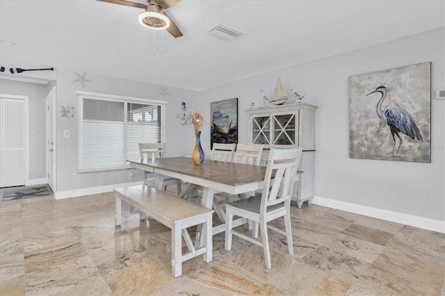 3701 Corsair Ct, New Port Richey, FL 34652 - dining room with a ceiling fan and baseboards