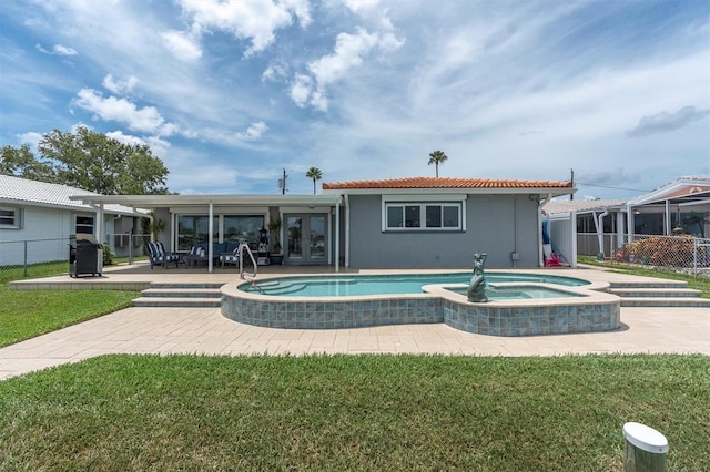 3701 Corsair Ct, New Port Richey, FL 34652 - back of property featuring french doors, stucco siding, a patio area, a pool with connected hot tub, and a tiled roof