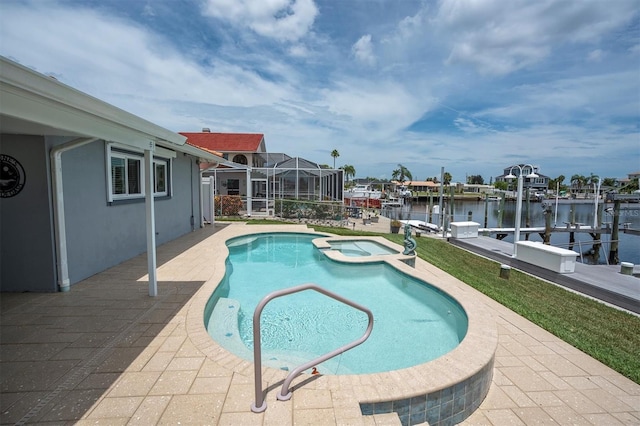 3701 Corsair Ct, New Port Richey, FL 34652 - view of pool with a boat dock, boat lift, a pool with connected hot tub, a water view, and a patio area
