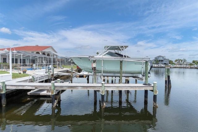3701 Corsair Ct, New Port Richey, FL 34652 - dock featuring boat lift and a water view