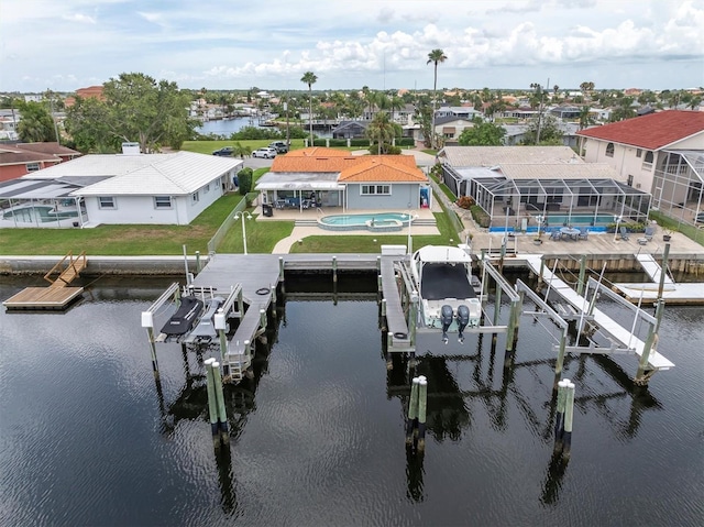 3701 Corsair Ct, New Port Richey, FL 34652 - dock area with boat lift, a water view, an outdoor pool, a patio, and a residential view