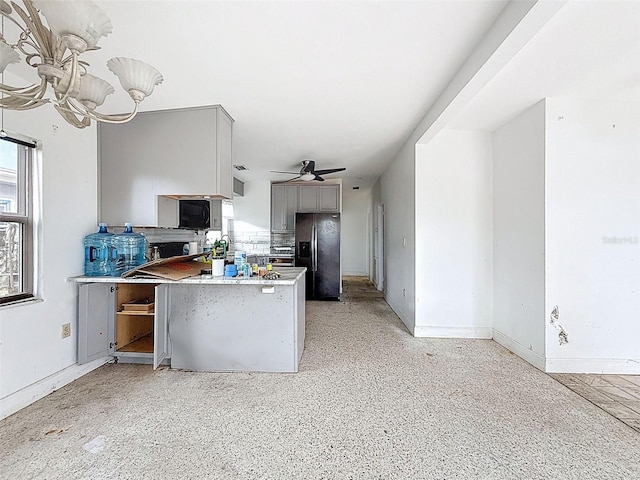 336 Boca Ciega Dr, Madeira Beach, FL 33708 - kitchen featuring fridge with ice dispenser, gray cabinets, a peninsula, light countertops, and a chandelier