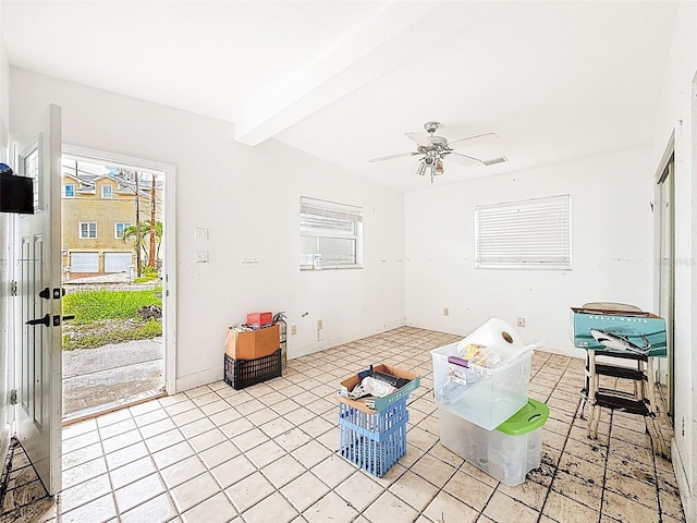 336 Boca Ciega Dr, Madeira Beach, FL 33708 - living room featuring plenty of natural light, beamed ceiling, light tile patterned floors, and a ceiling fan