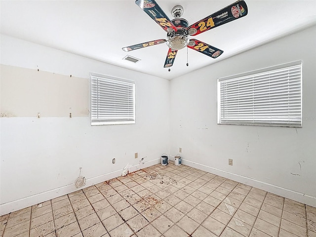 336 Boca Ciega Dr, Madeira Beach, FL 33708 - spare room with ceiling fan and baseboards