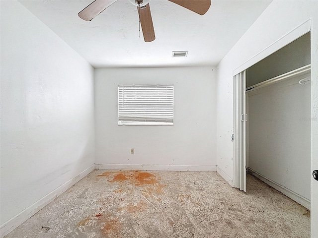 336 Boca Ciega Dr, Madeira Beach, FL 33708 - unfurnished bedroom with ceiling fan and a closet