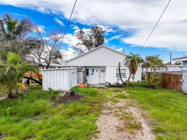336 Boca Ciega Dr, Madeira Beach, FL 33708 - back of house with a storage shed