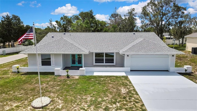 4360 Talco Ave, Spring Hill, FL 34609 - ranch-style house with roof with shingles, a garage, french doors, and concrete driveway